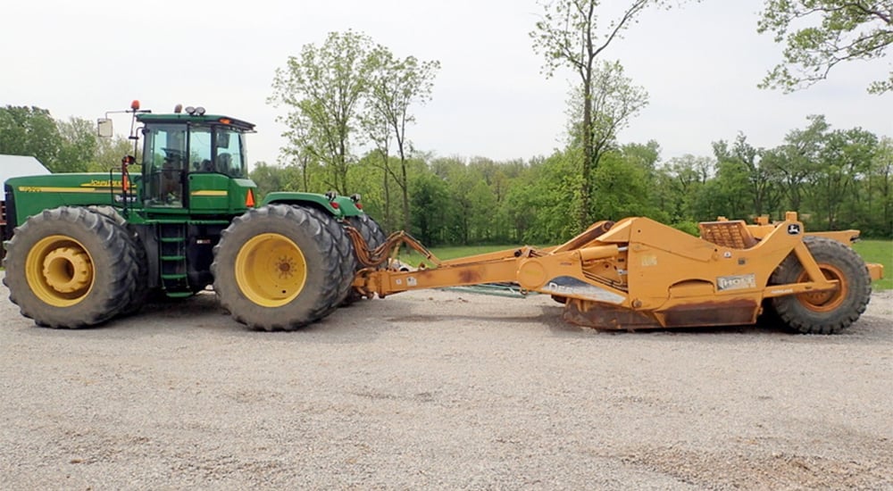 John Deere tractor and scraper
